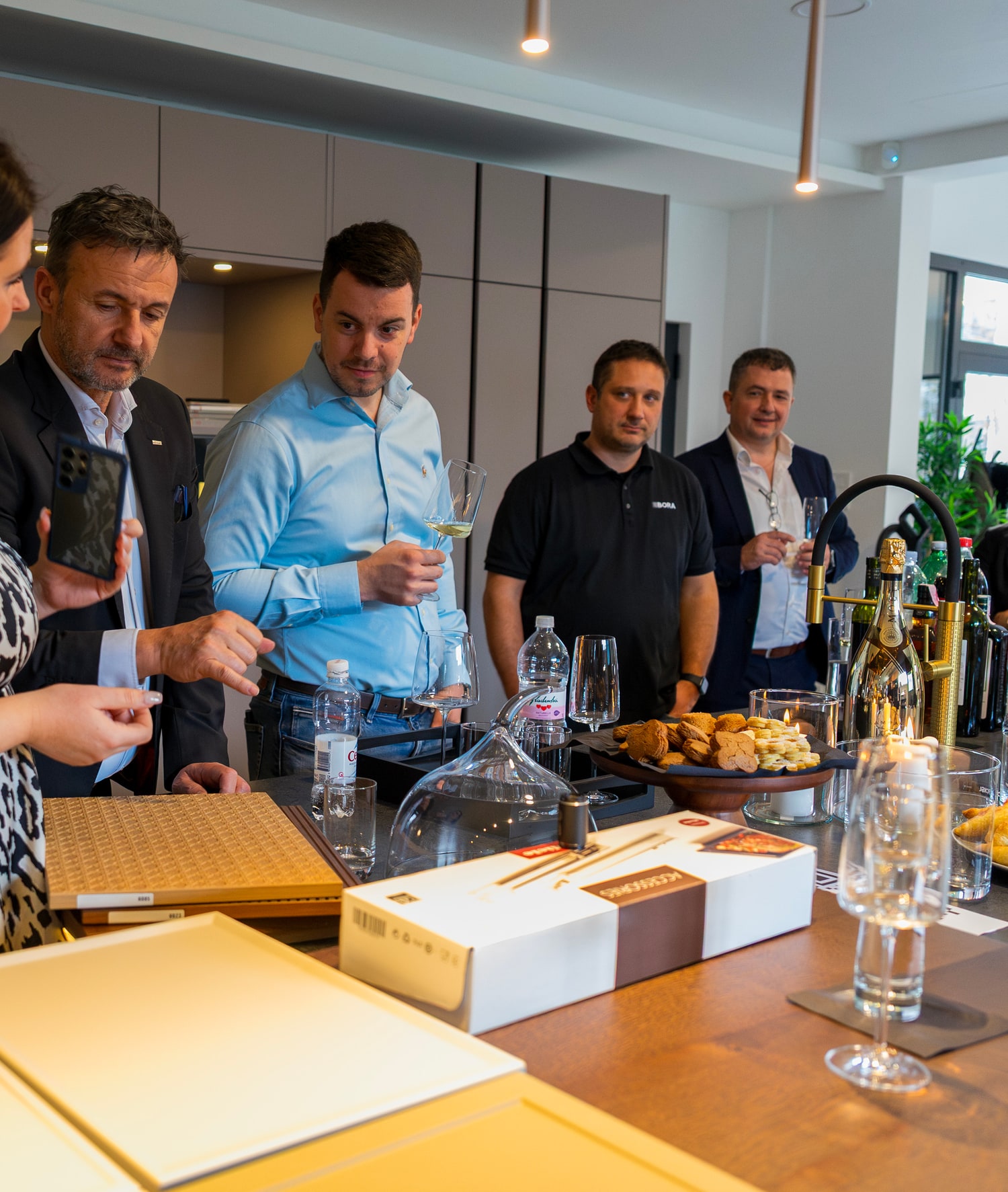 Partners at a kitchen workshop — hands-on with materials and planning.
